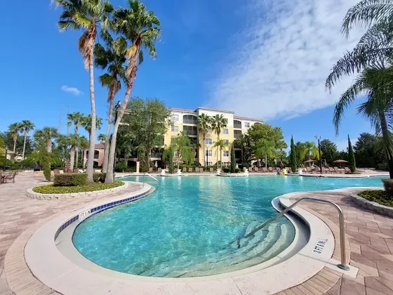 Pool and palm trees at World Quest Resort, Orlando